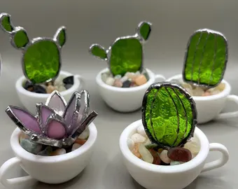 snake plant in vintage teapot quirky planter